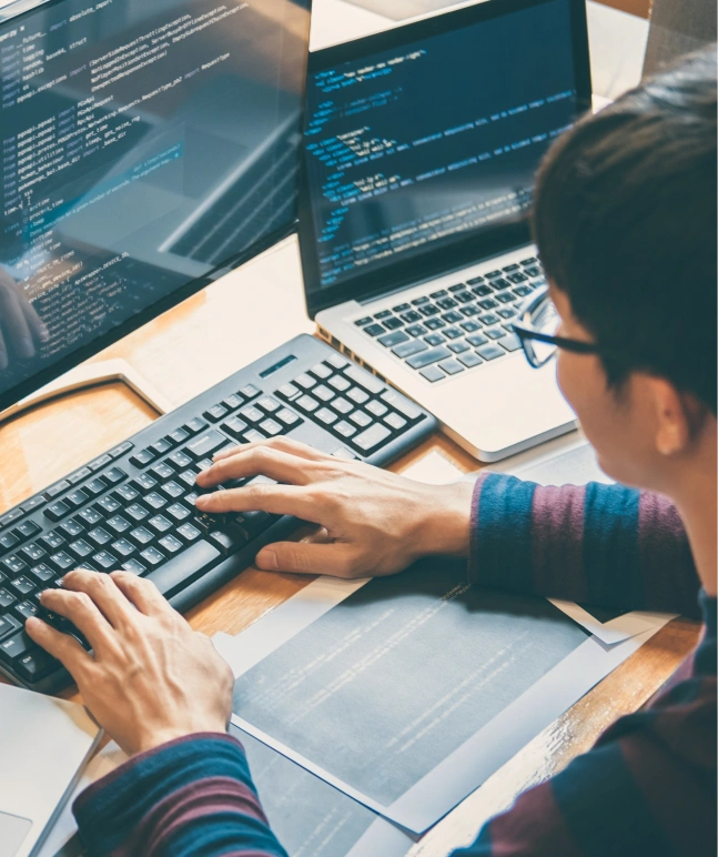 A software engineer writing the code for a software application.